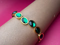 Emerald Green Oval Crystal Bangle – Luxury Gold-Tone Stainless Steel Bracelet